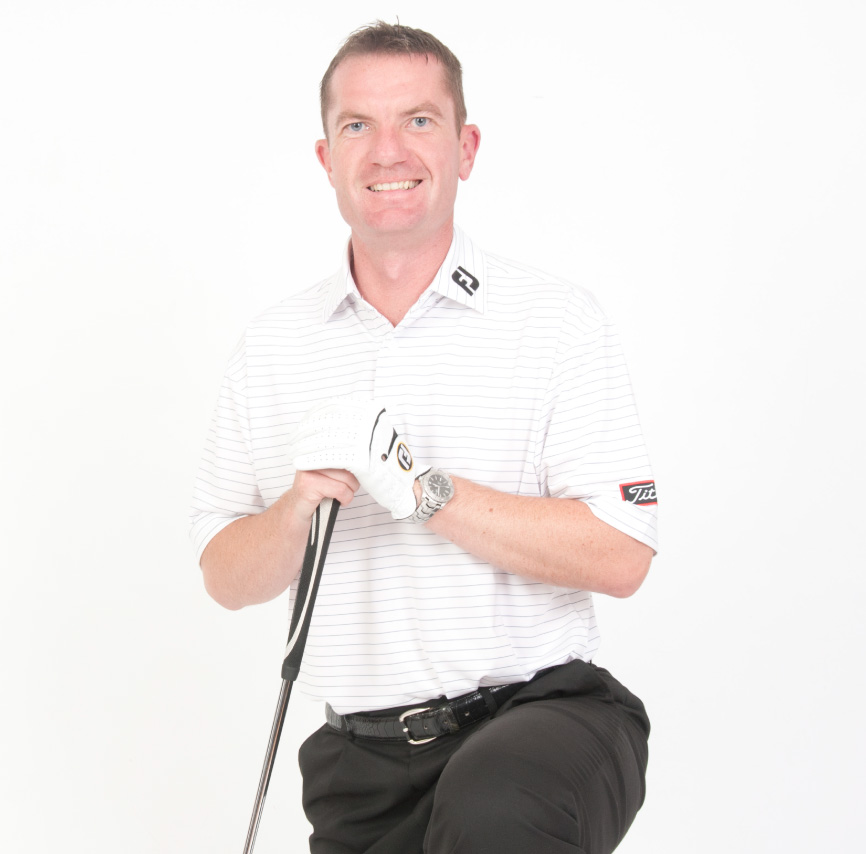 Sandy Smith kneeling with a golf club